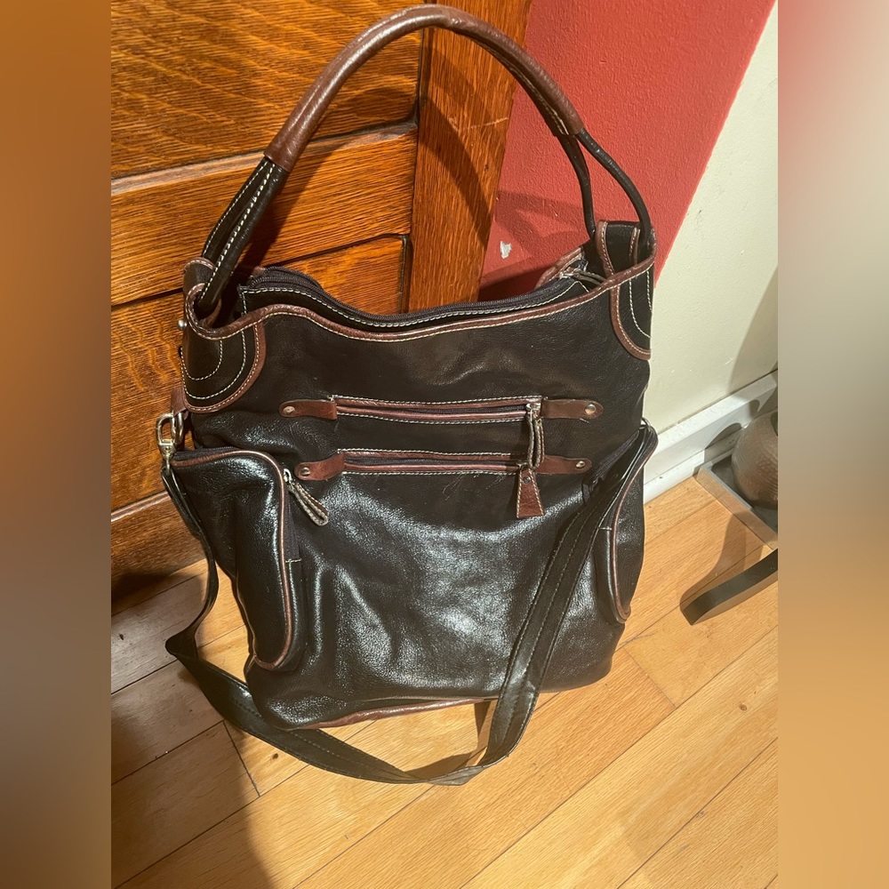 Black trim in brown crossbody and carrying case
